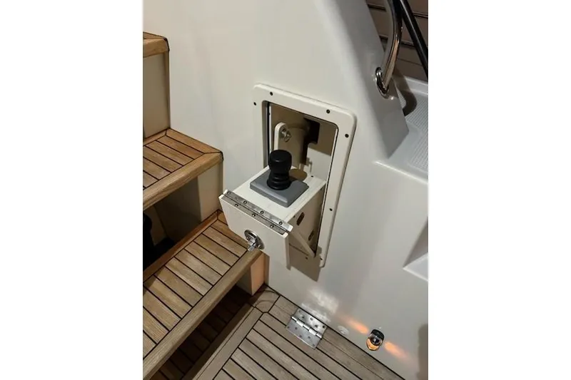 Slide: The Image of Joystick control on 2009 Mikelson Zeus Sportfisher boat, near wooden steps. - 35