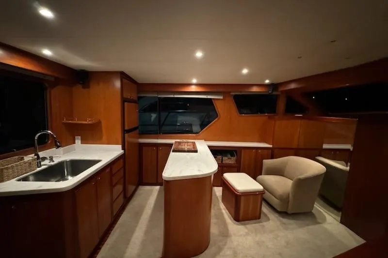 Slide: The Image of Luxurious interior of 2009 Mikelson Zeus Sportfisher yacht with modern kitchen and seating area. - 8