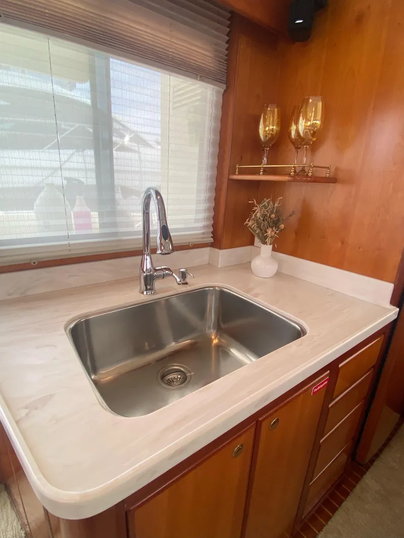 Slide: The Image of 2009 Mikelson Zeus Sportfisher kitchen area with stainless steel sink. - 9