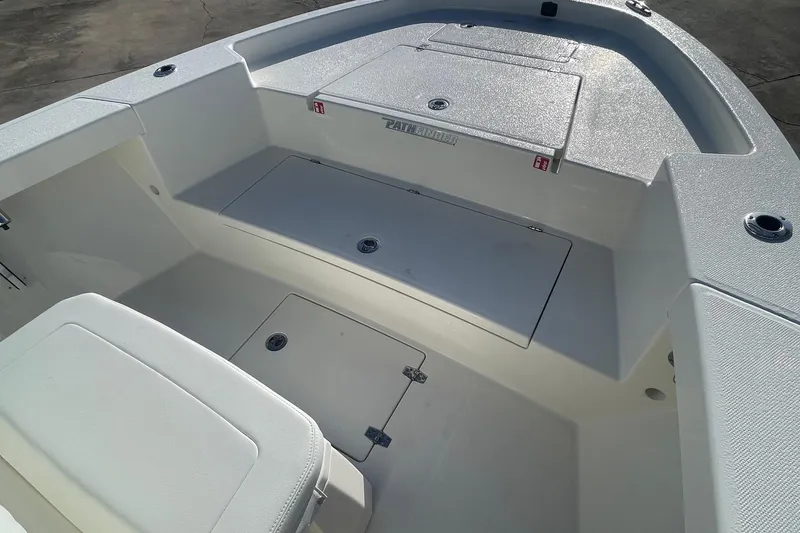 Slide: The Image of 2026 Pathfinder 2400 Open boat interior with storage compartments and seating. - 13