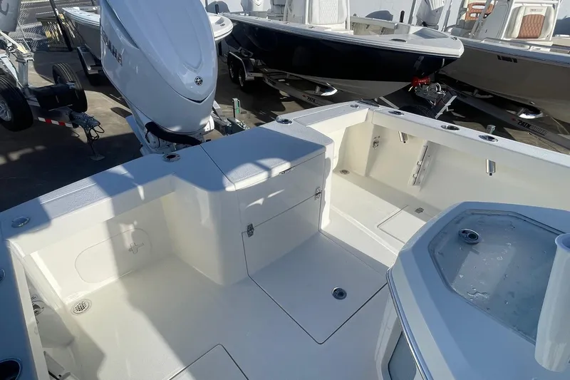 Slide: The Image of 2026 Pathfinder 2400 Open boat interior with spacious deck and modern outboard motor. - 3