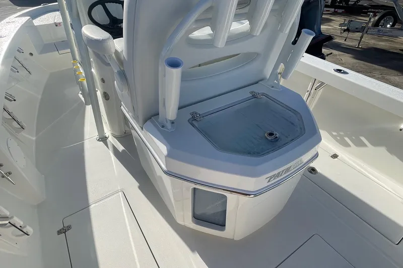 Slide: The Image of 2026 Pathfinder 2400 Open boat interior with rod holders and storage compartment. - 5