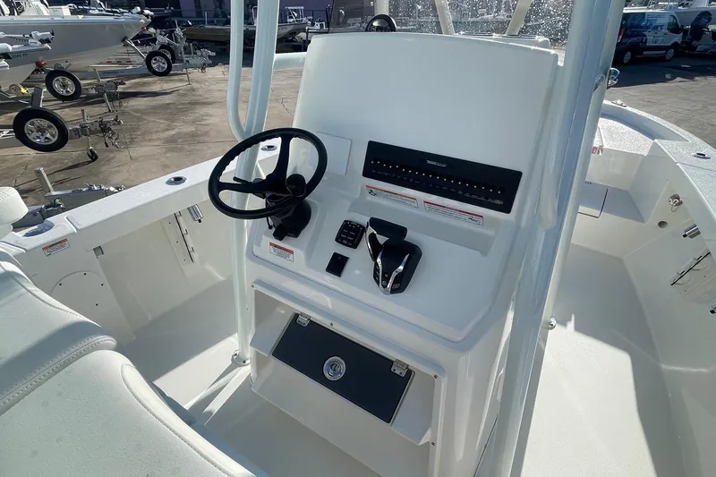 Slide: The Image of 2026 Pathfinder 2400 Open boat console with steering wheel and controls. - 6