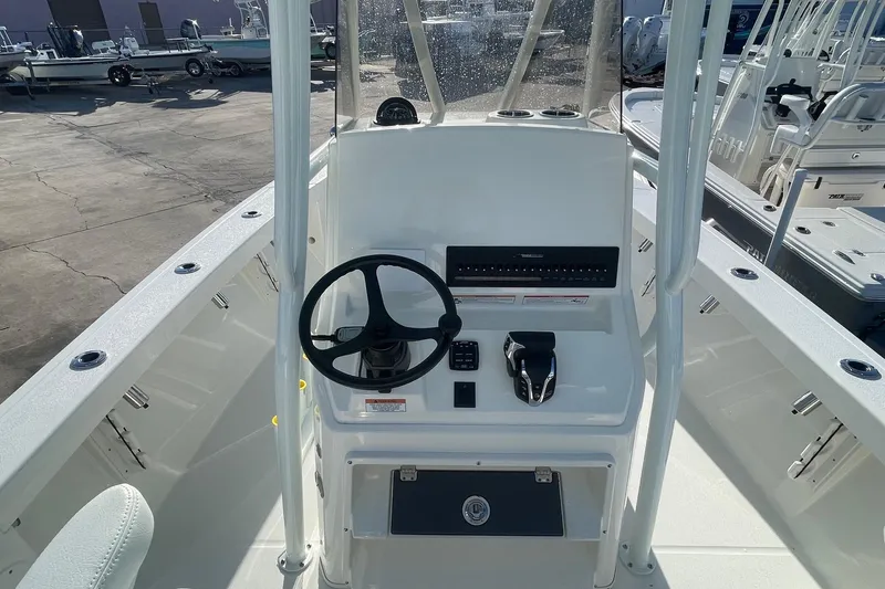 Slide: The Image of 2026 Pathfinder 2400 Open boat console with steering wheel and controls. - 9