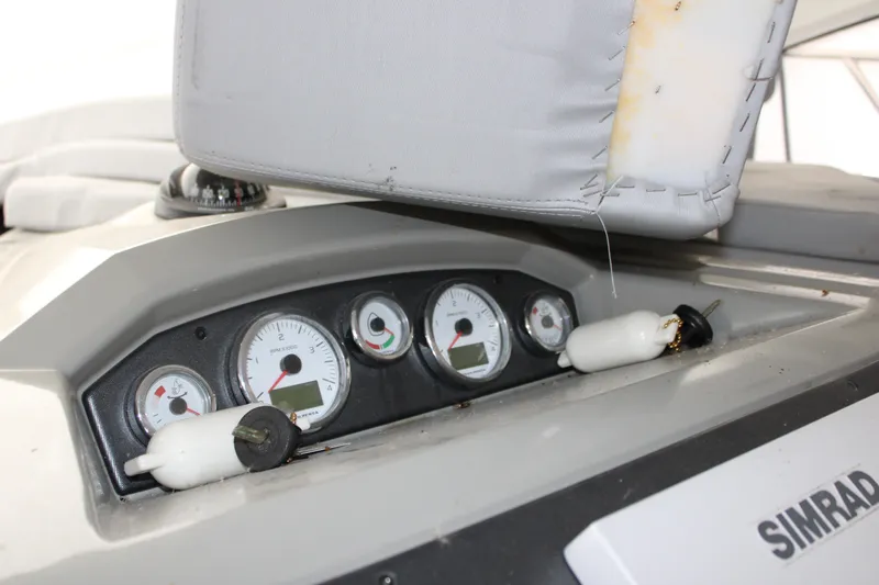 Slide: The Image of Dashboard of a 2012 Beneteau Gran Turismo 38 with gauges and Simrad equipment. - 12