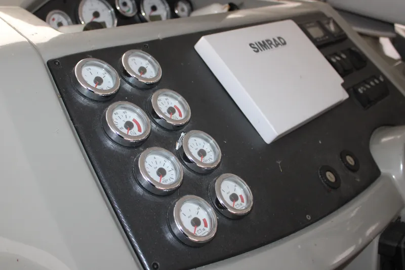 Slide: The Image of Control panel of 2012 Beneteau Gran Turismo 38 with Simrad display and gauges. - 13