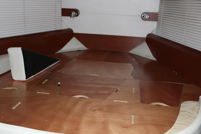 Slide: The Image of Interior of 2012 Beneteau Gran Turismo 38 yacht, featuring wooden flooring and blinds. - 16