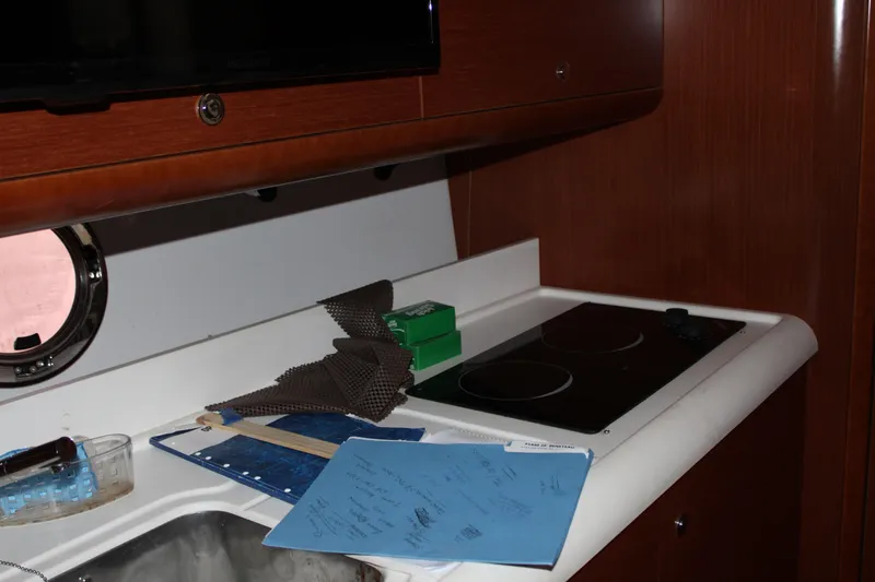 Slide: The Image of Interior of 2012 Beneteau Gran Turismo 38 yacht kitchen with stove and sink. - 17