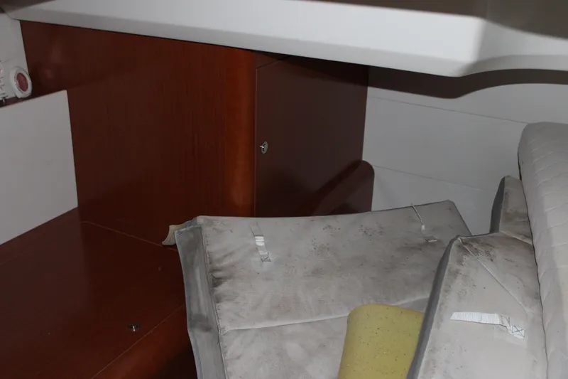 Slide: The Image of Interior cabin of 2012 Beneteau Gran Turismo 38 with cushions and wooden cabinetry. - 20