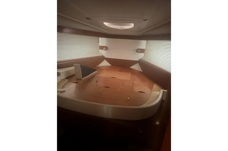 Slide: The Image of Interior cabin of 2012 Beneteau Gran Turismo 38 yacht with wooden furnishings. - 25
