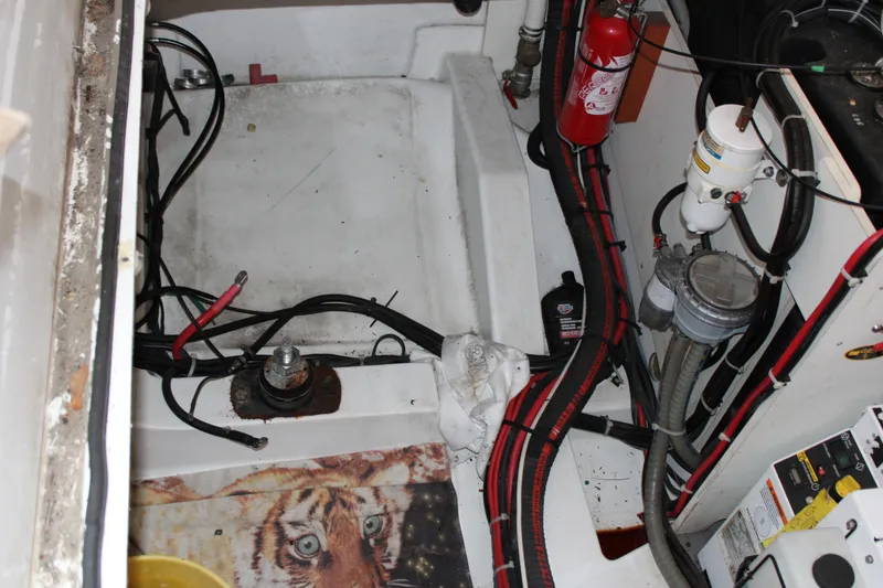 Slide: The Image of Engine compartment of a 2012 Beneteau Gran Turismo 38 with wiring and fire extinguisher. - 28