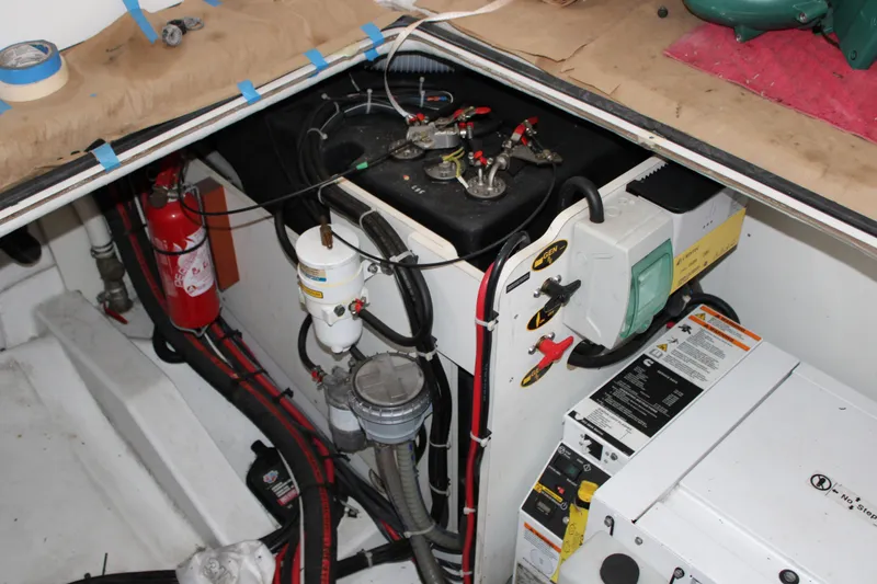 Slide: The Image of Engine compartment of 2012 Beneteau Gran Turismo 38 with generator and fire extinguisher. - 29