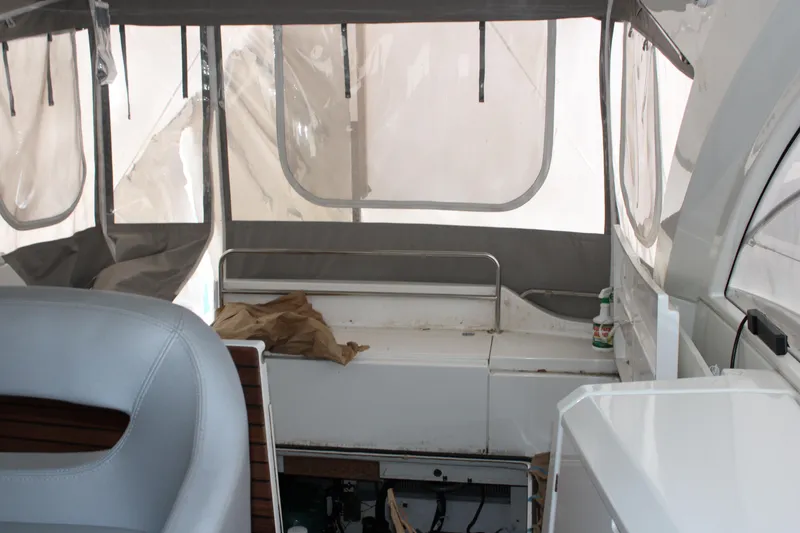 Slide: The Image of Interior view of 2012 Beneteau Gran Turismo 38 yacht with seating and covered windows. - 5