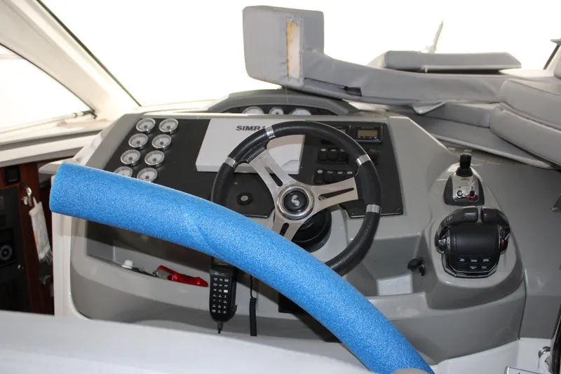 Slide: The Image of Cockpit of 2012 Beneteau Gran Turismo 38 with steering wheel and controls. - 8