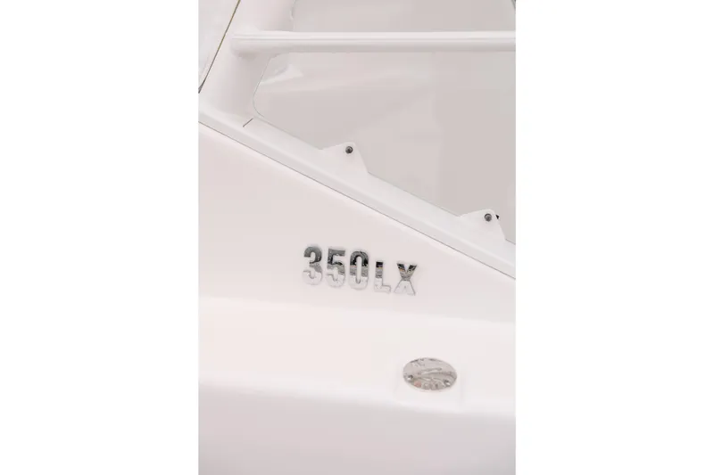 Slide: The Image of Close-up of 2010 Everglades 350LX boat model emblem on white surface. - 11