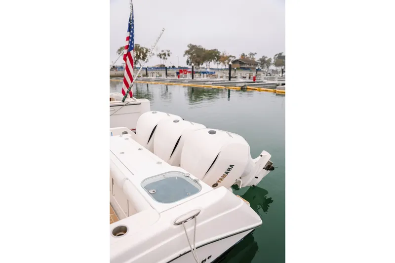 Slide: The Image of 2010 Everglades 350LX boat with Yamaha engines docked at marina. - 14