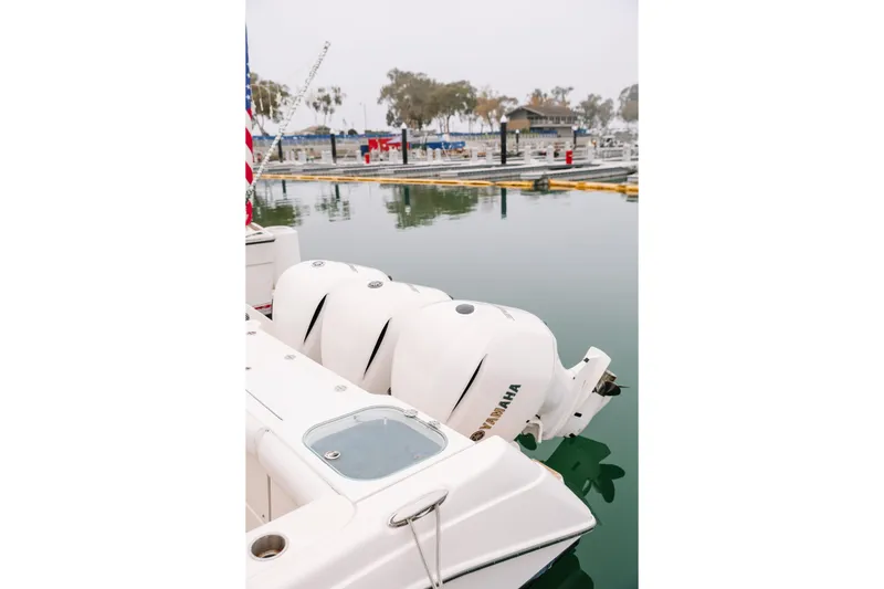 Slide: The Image of 2010 Everglades 350LX boat with Yamaha engines docked at marina. - 15