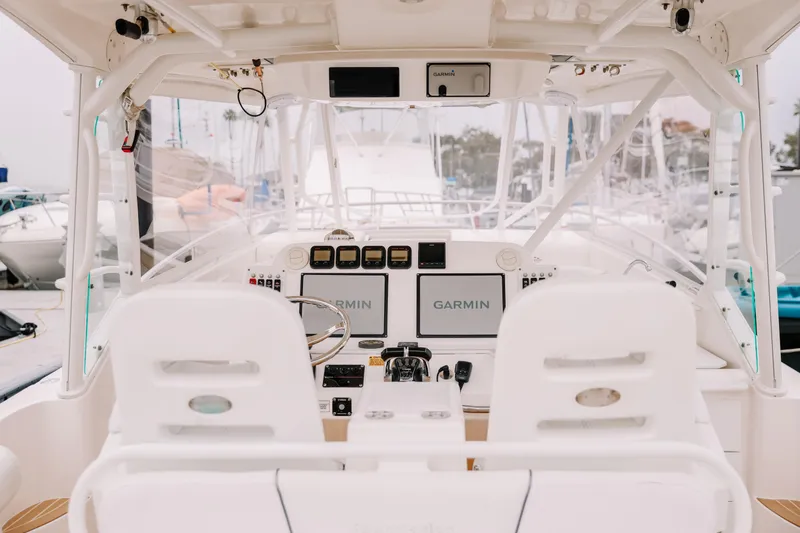 Slide: The Image of Cockpit of 2010 Everglades 350LX boat with Garmin navigation system. - 16