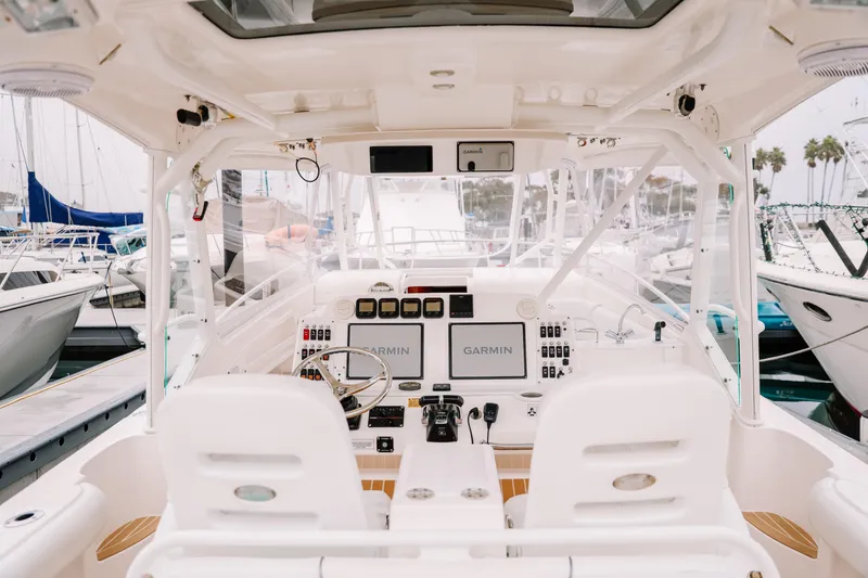 Slide: The Image of Interior view of 2010 Everglades 350LX boat cockpit with Garmin navigation system. - 17