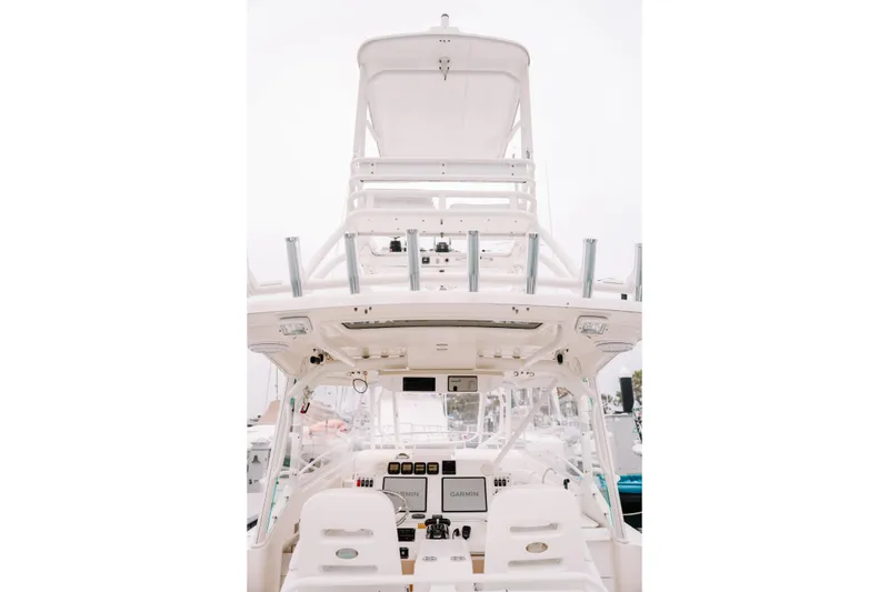 Slide: The Image of 2010 Everglades 350LX boat cockpit with advanced navigation equipment and seating. - 18