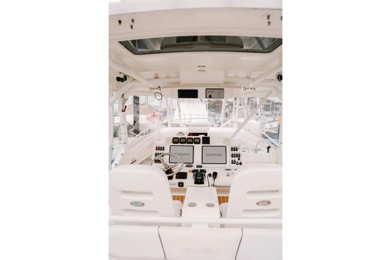 Slide: The Image of Interior view of 2010 Everglades 350LX boat cockpit with navigation equipment. - 19