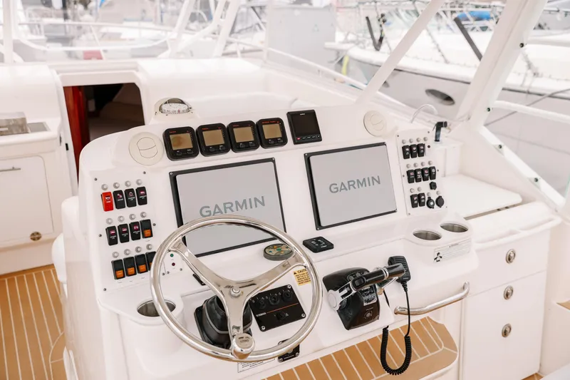 Slide: The Image of Cockpit of 2010 Everglades 350LX boat with Garmin navigation system and control panel. - 20