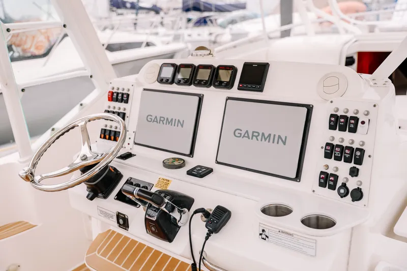Slide: The Image of Control panel of 2010 Everglades 350LX boat with Garmin navigation displays. - 21