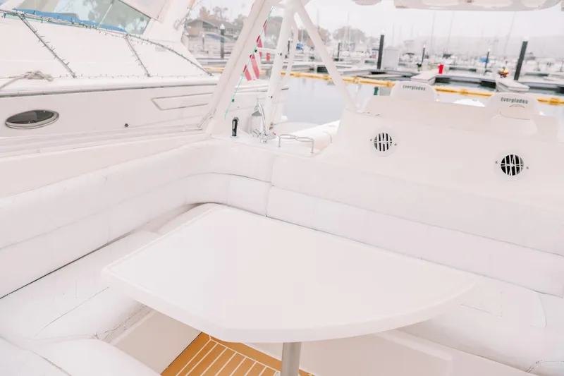 Slide: The Image of Luxurious seating area on a 2010 Everglades 350LX boat at a marina. - 26