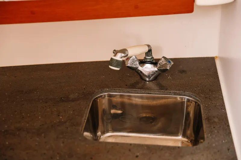 Slide: The Image of Stainless steel sink with faucet in 2010 Everglades 350LX boat interior. - 29
