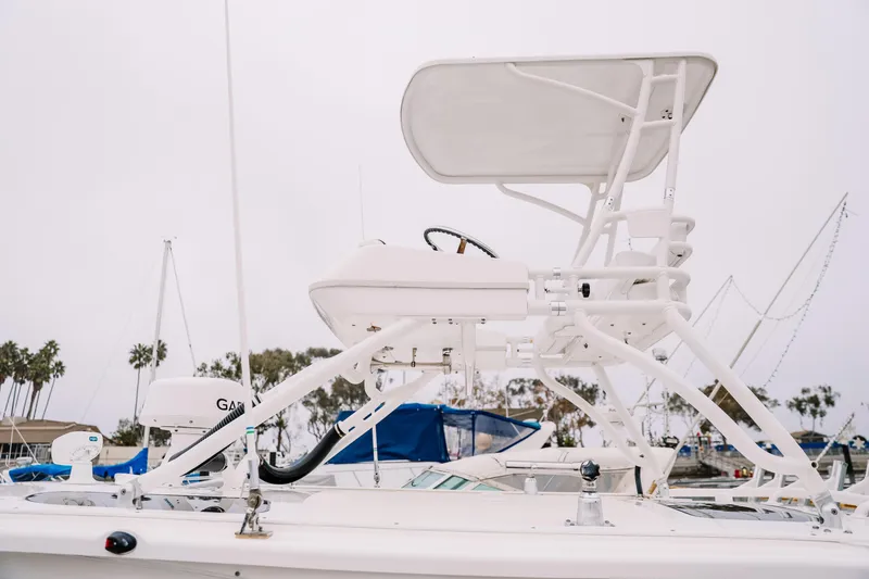 Slide: The Image of 2010 Everglades 350LX boat with elevated helm station in marina setting. - 5