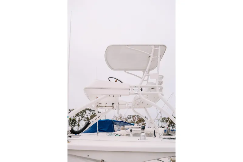 Slide: The Image of 2010 Everglades 350LX boat with elevated helm station, docked in marina. - 6