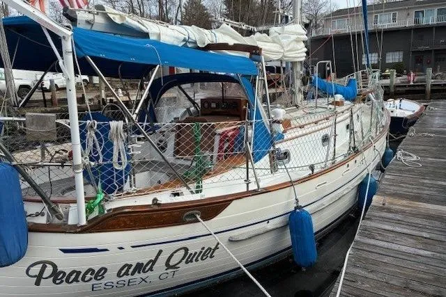 Slide: The Image of 1986 Tayana 37 sailboat named "Peace and Quiet" docked in Essex, CT. - 18