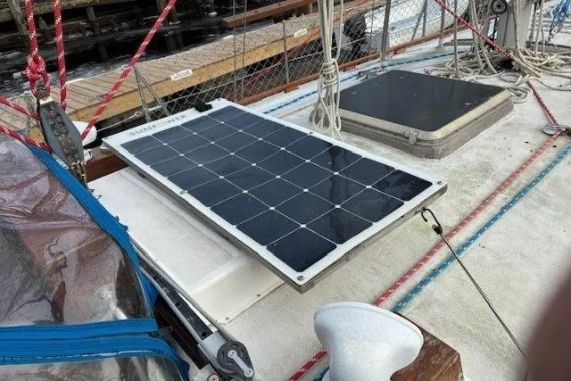 Slide: The Image of 1986 Tayana 37 sailboat deck with solar panel and rigging. - 21