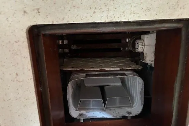 Slide: The Image of 1986 Tayana 37 boat interior showing a built-in storage compartment. - 24