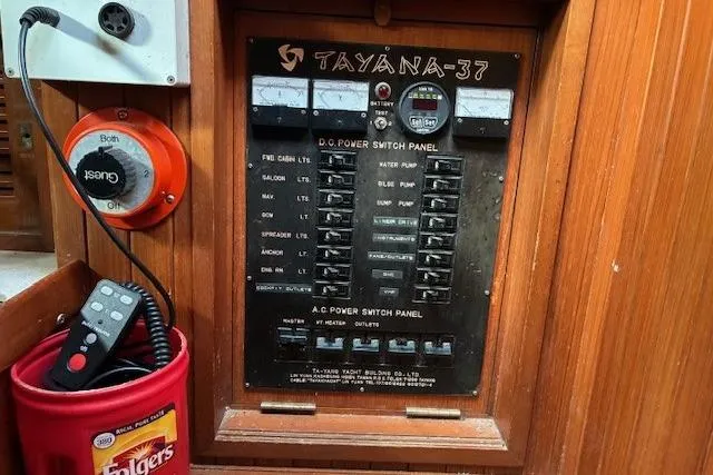 Slide: The Image of Electrical panel of a 1986 Tayana 37 sailboat with switches and controls. - 25