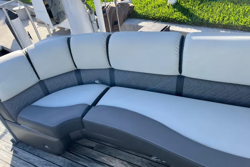 Slide: The Image of Luxurious seating on 2022 Veranda VP 25RC boat, featuring elegant gray and white upholstery. - 11