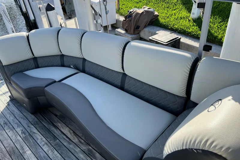 Slide: The Image of Luxurious seating on 2022 Veranda VP 25RC pontoon boat, featuring elegant gray upholstery. - 13