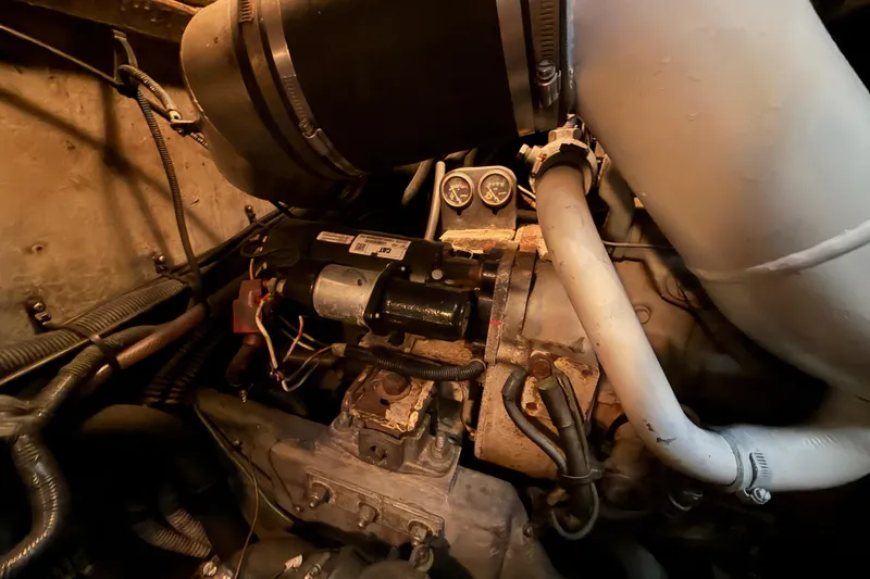 Slide: The Image of Engine compartment of a 1997 Sea Ray 370 Aft Cabin boat, showing mechanical components. - 102