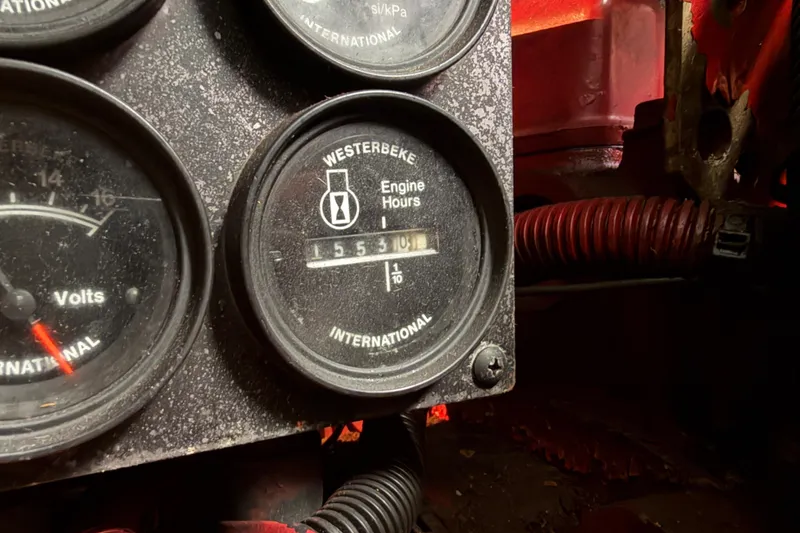 Slide: The Image of Close-up of 1997 Sea Ray 370 Aft Cabin engine hour meter showing 1553 hours. - 103