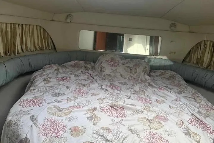 Slide: The Image of 1997 Sea Ray 370 Aft Cabin yacht sink area with white countertop and faucet. - 11