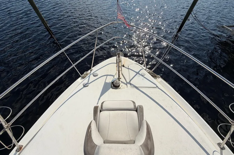 Slide: The Image of 1997 Sea Ray 370 Aft Cabin boat deck with sparkling water view. - 16