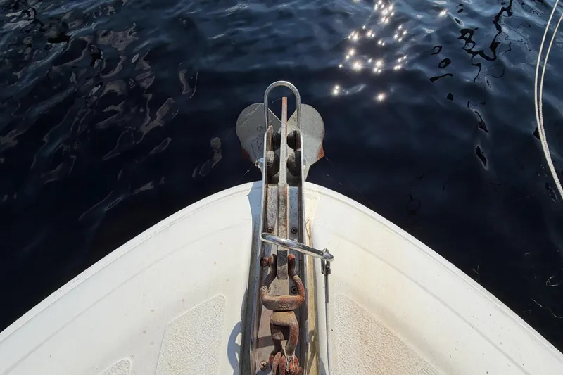 Slide: The Image of Bow of 1997 Sea Ray 370 Aft Cabin yacht with anchor over water. - 17