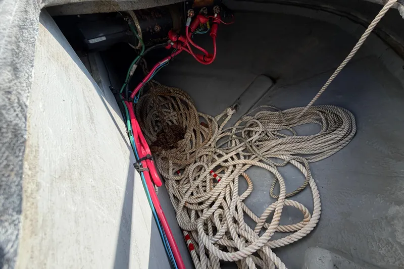 Slide: The Image of Rope and wiring inside a 1997 Sea Ray 370 Aft Cabin boat compartment. - 18