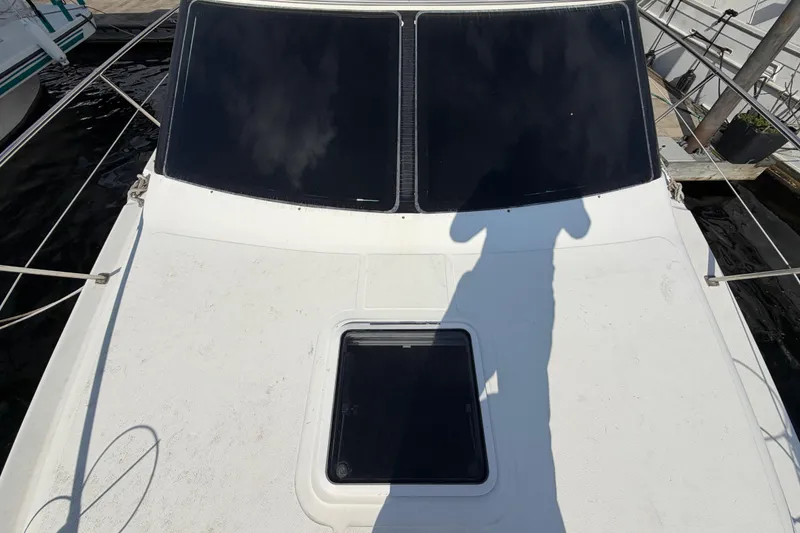 Slide: The Image of 1997 Sea Ray 370 Aft Cabin boat deck with shadow and hatch. - 22