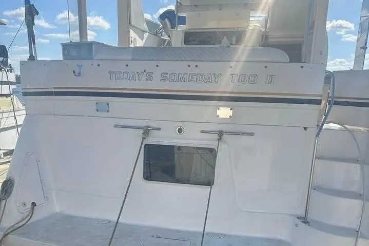 Slide: The Image of 1997 Sea Ray 370 Aft Cabin yacht docked at marina under blue sky. - 3