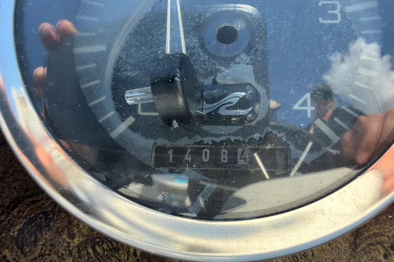 Slide: The Image of Close-up of a 1997 Sea Ray 370 Aft Cabin boat gauge showing 14084 hours. - 31