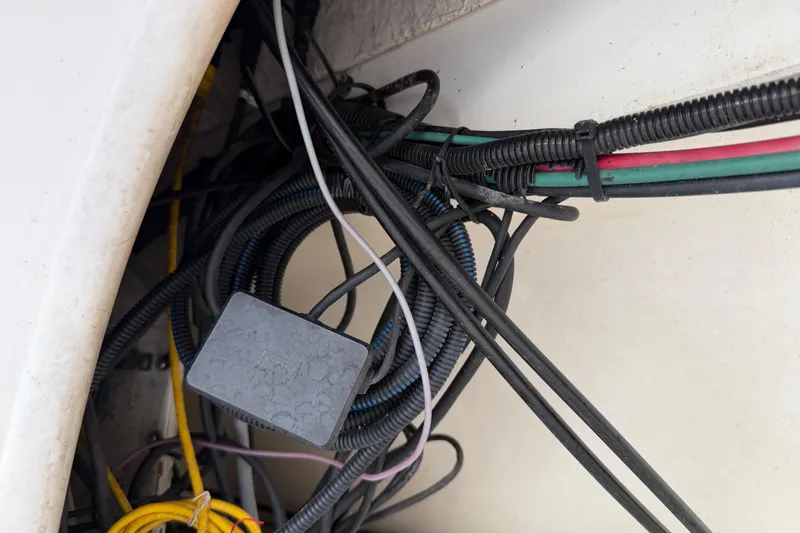 Slide: The Image of Tangled wiring inside a 1997 Sea Ray 370 Aft Cabin boat. - 37