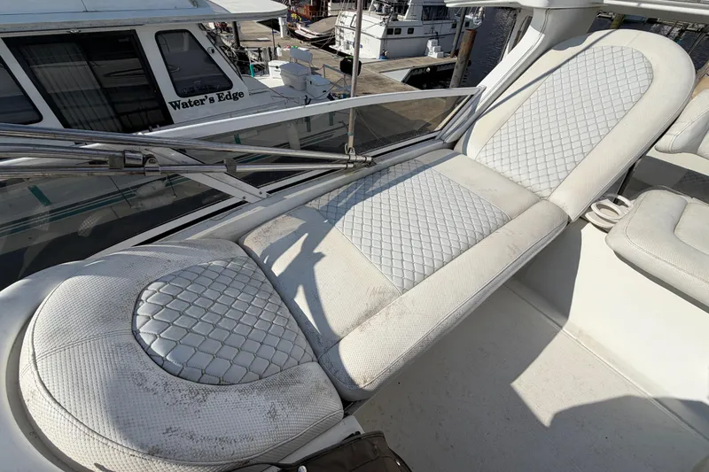 Slide: The Image of 1997 Sea Ray 370 Aft Cabin boat with white cushioned seating on deck. - 42