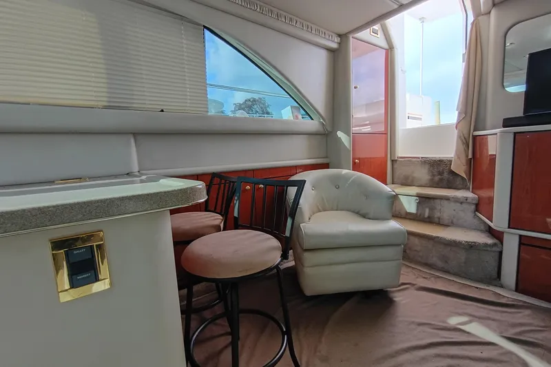 Slide: The Image of Interior of 1997 Sea Ray 370 Aft Cabin yacht with seating and stairs. - 52