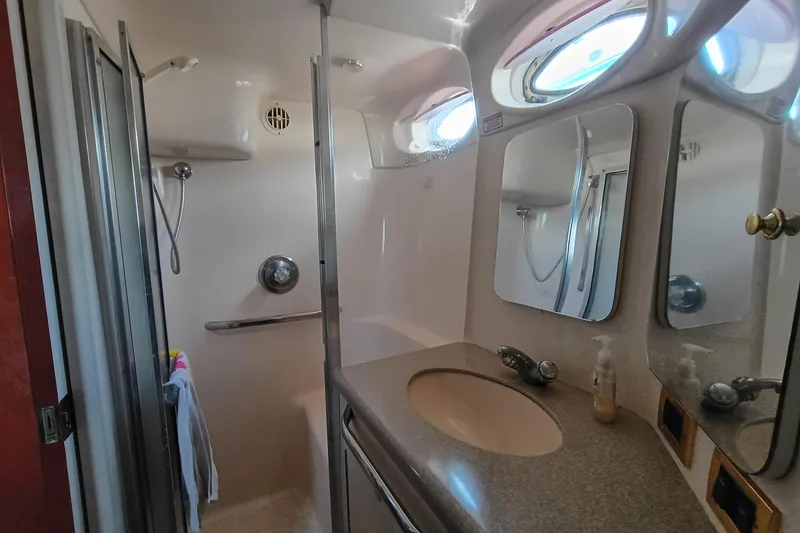 Slide: The Image of Bathroom interior of 1997 Sea Ray 370 Aft Cabin yacht with shower and sink. - 68